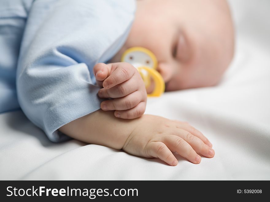 Photo of a baby sleeping, focused on hands. Photo of a baby sleeping, focused on hands
