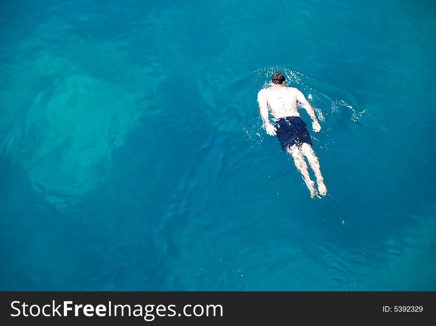 Swimming in crystal clear waters of the Adriatic. Swimming in crystal clear waters of the Adriatic