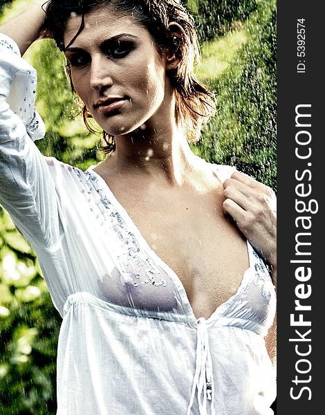 Brunette In White Blouse Standing In The Rain