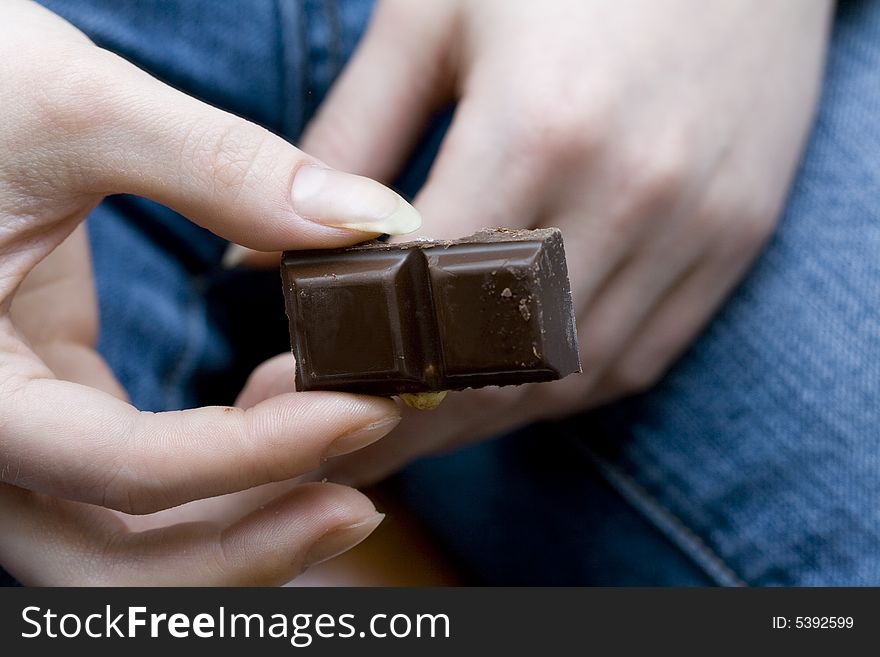 Chocolate pieces in woman's hands. Chocolate pieces in woman's hands