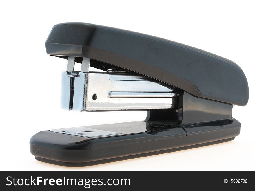 It is black a steel stapler on a white background separately one.