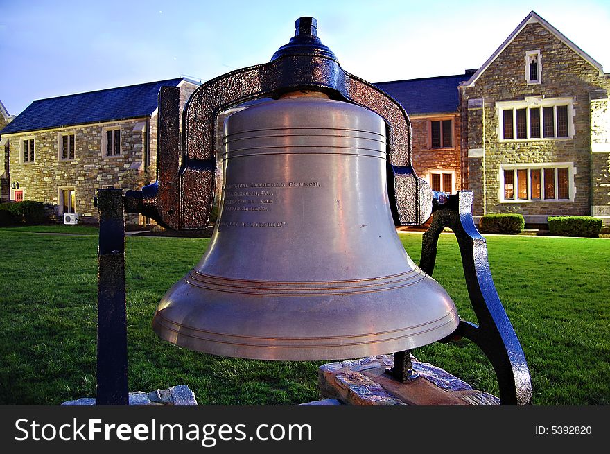 Beautiful old church bell standing in church yard