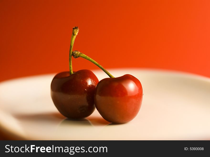 Cherries placed on red background. Cherries placed on red background.