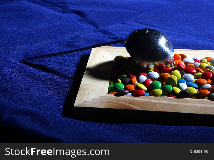 Many colored candies and a frame