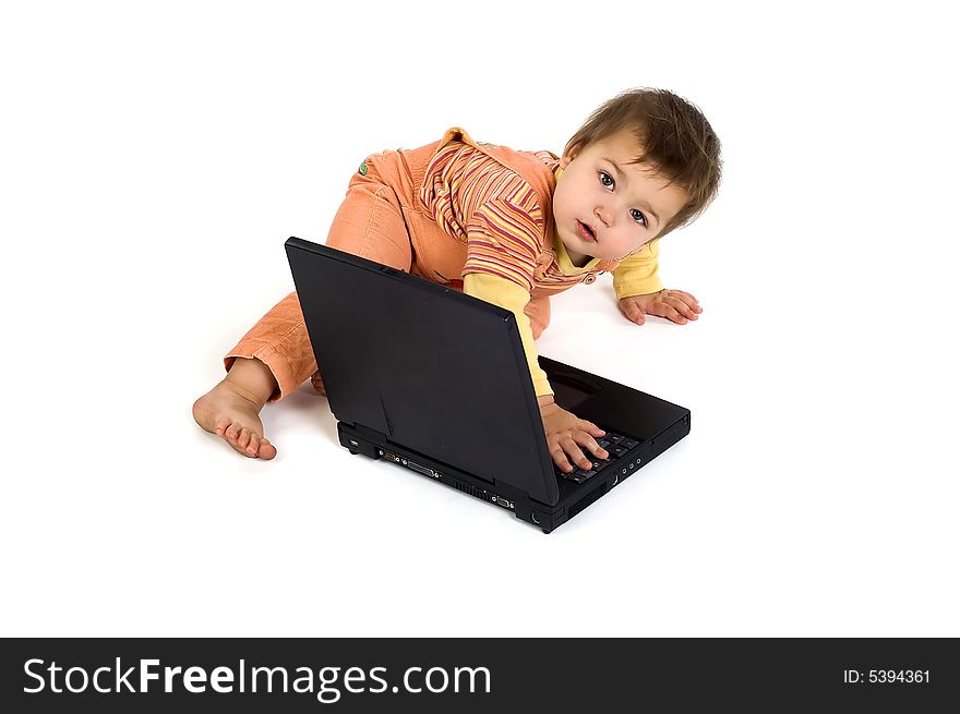 Orange dressed astonished boy working on laptop