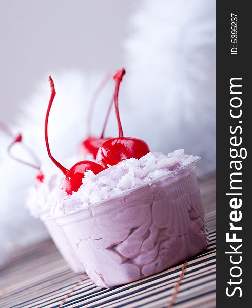 Sweet dessert with cherry close up