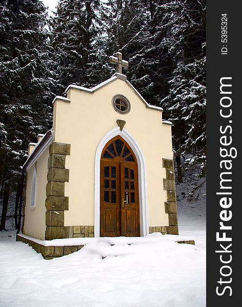 Small chapel in a snow-covered wood. Small chapel in a snow-covered wood