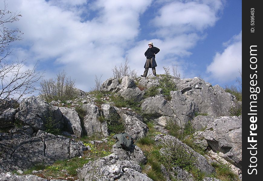 Guy standing on top of the hill