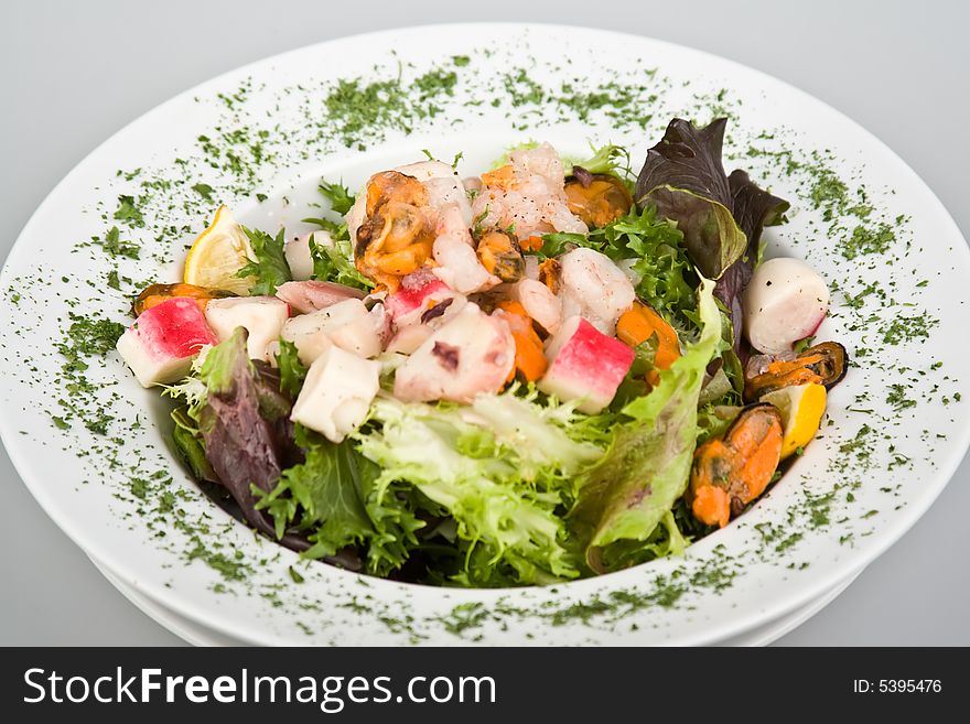 Fresh sea salad with parsley isolated on white