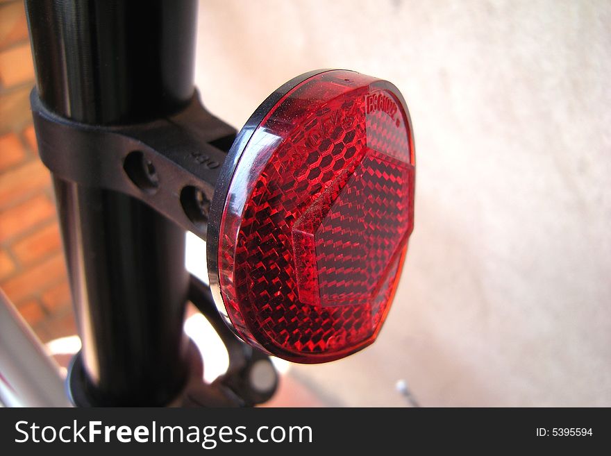 Red bicycle tire and bricks background