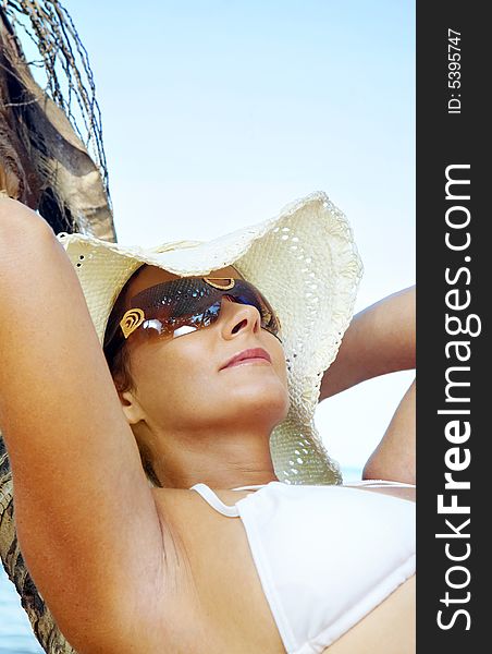 View of nice woman having fun on tropical beach. View of nice woman having fun on tropical beach