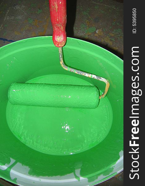Green paint bucket and roller