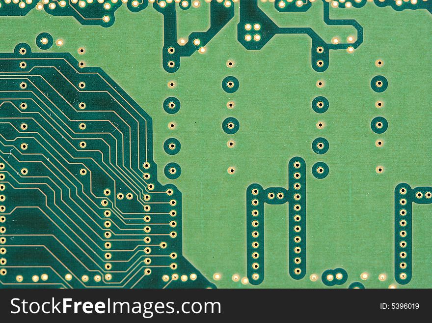 The Back of a green circuit board. The Back of a green circuit board