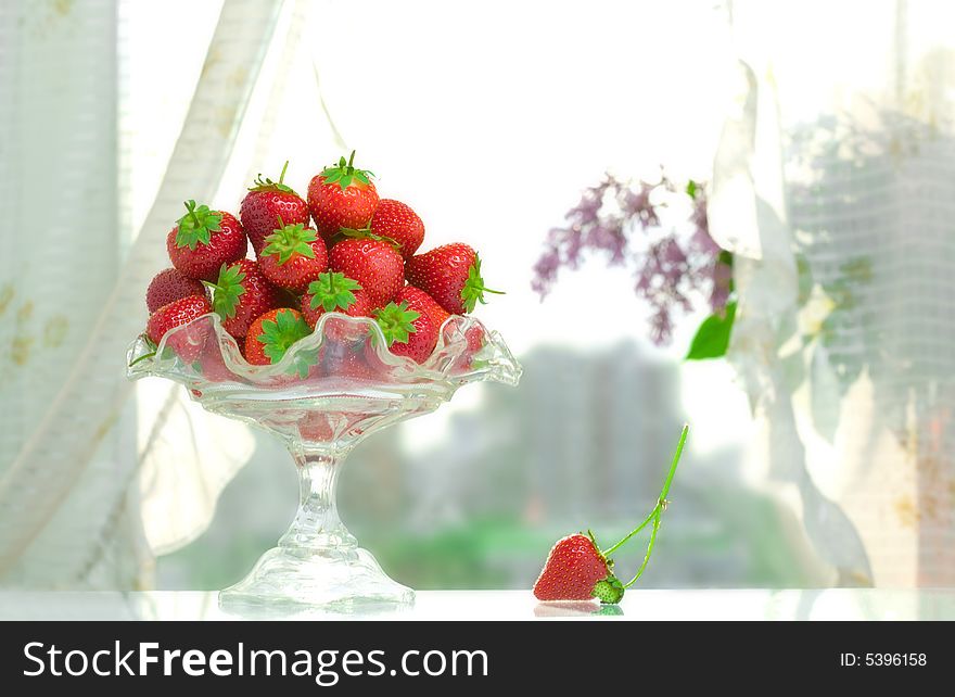 High key photo of fruit dish filled with nice red strawberries. High key photo of fruit dish filled with nice red strawberries