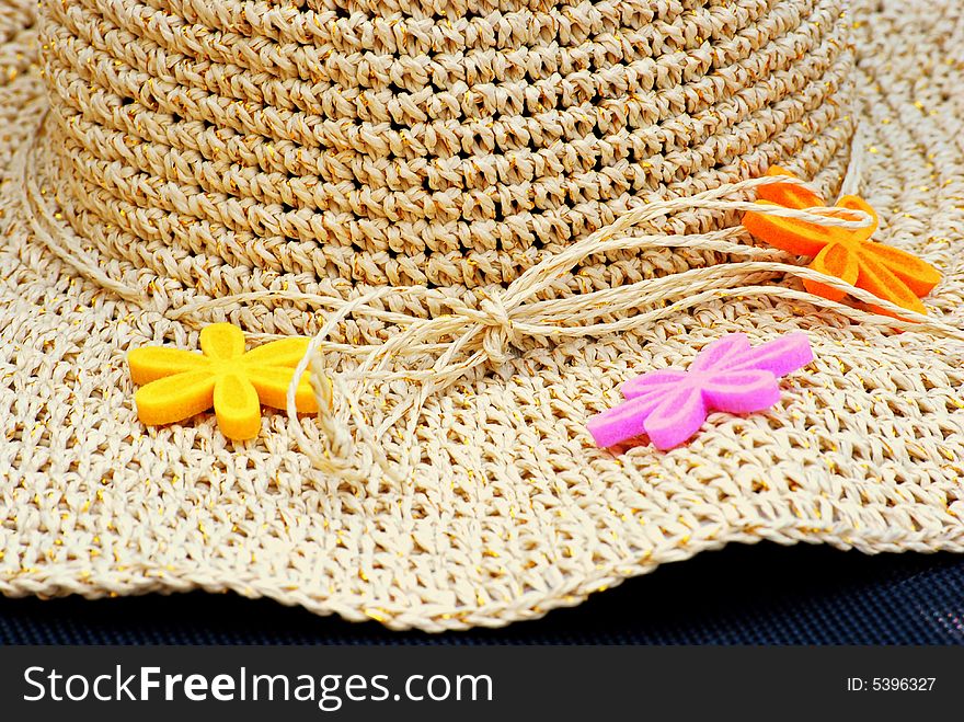 Close up of a sun hat and flowers