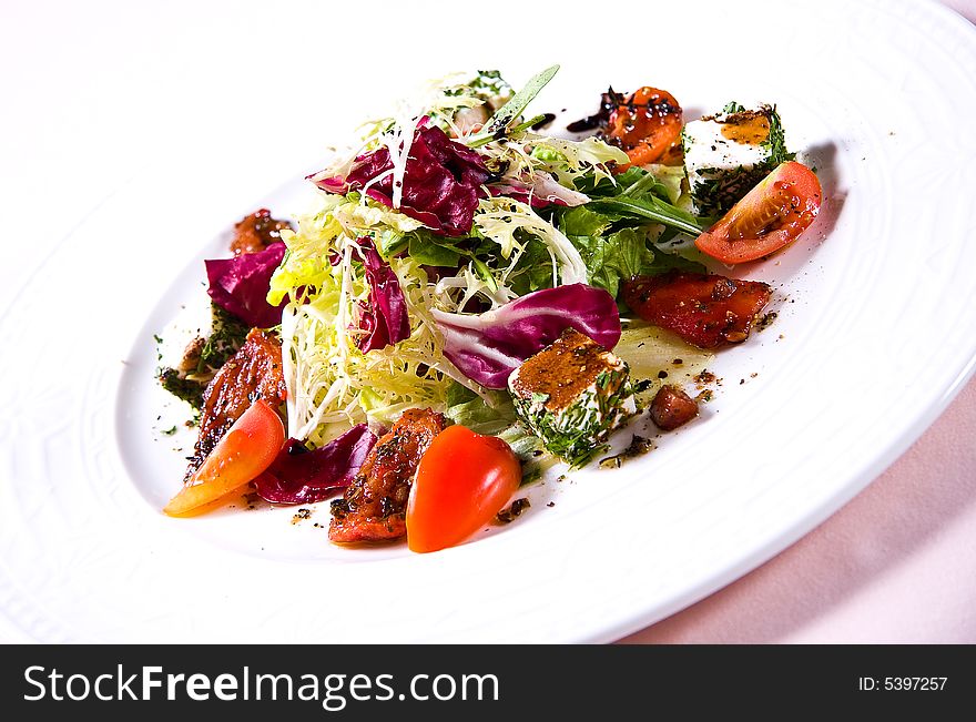 Vegetable salad with cheese isolated on white