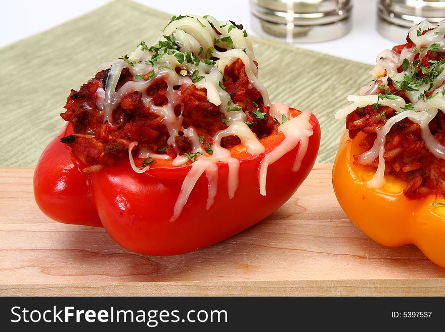 Peppers stuffed with beef, rice, tomato mixture and topped with mozzarella. Peppers stuffed with beef, rice, tomato mixture and topped with mozzarella