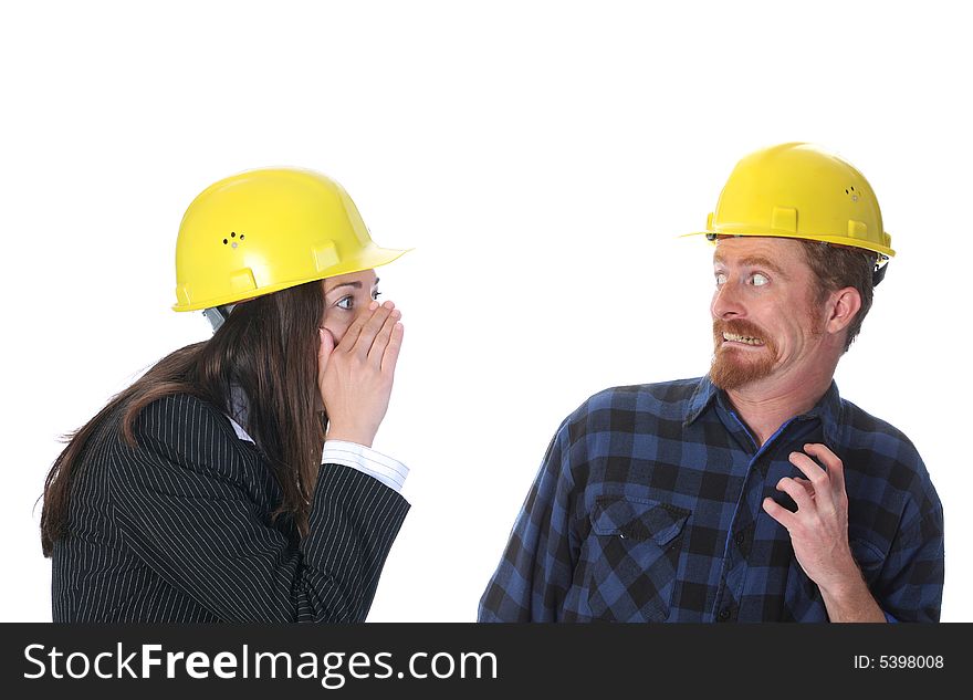 Businesswoman gestures telling something to afraid construction worker on workplace. Businesswoman gestures telling something to afraid construction worker on workplace