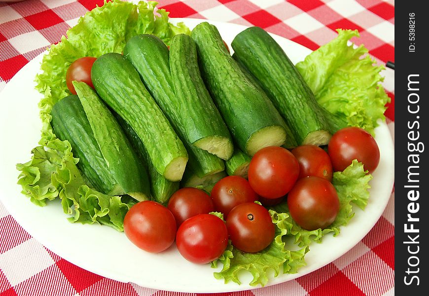 Fresh baby tomatoes and cucumbers. Fresh baby tomatoes and cucumbers.