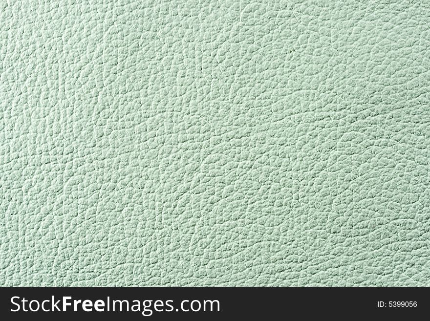 Natural qualitative pistachio green leather texture. Close up. Natural qualitative pistachio green leather texture. Close up.