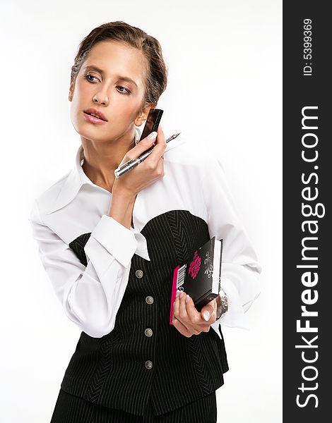 Attractive Fine business-lady holds phone and a pen