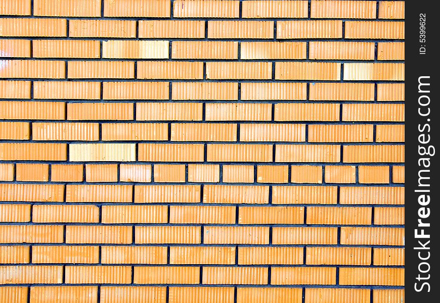 Wall made of red and yellow bricks. Wall made of red and yellow bricks