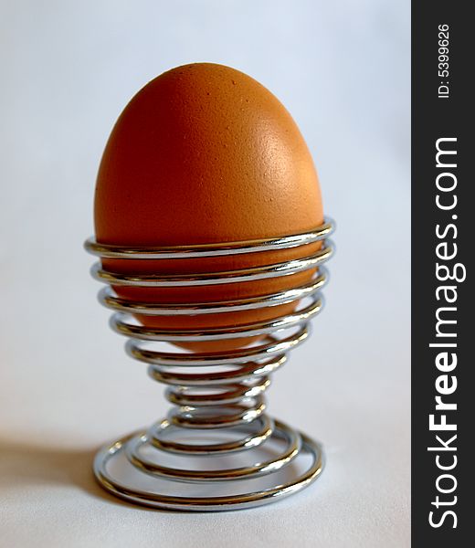 Photo of boiled egg in steel holder