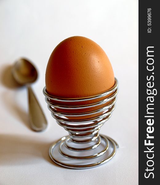 Photo of boiled egg in steel holder