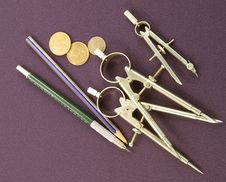 Drafting Instruments And Coins Royalty Free Stock Images
