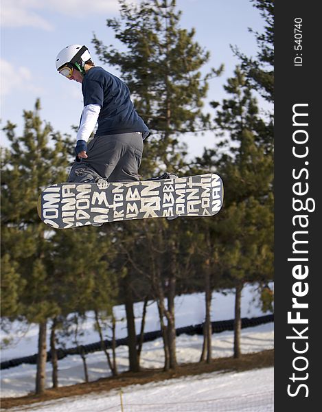 Snowboarder Launching off Jump