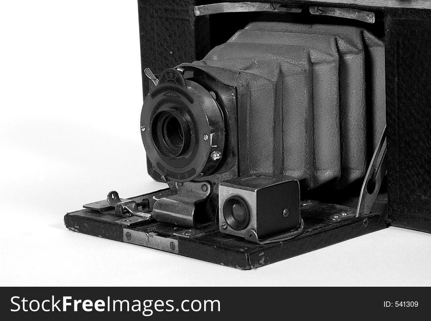Old camera with bellows and viewfinder.