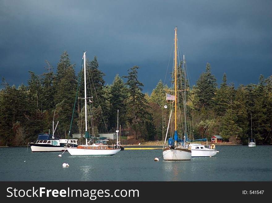 Sailboats in the harbor on a stormy day