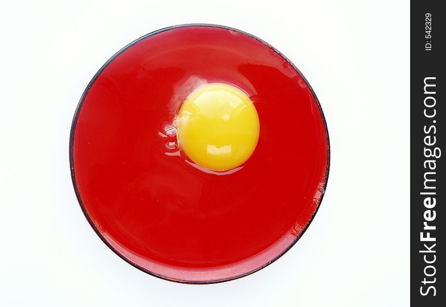 Still life with egg on red and white colours. Still life with egg on red and white colours