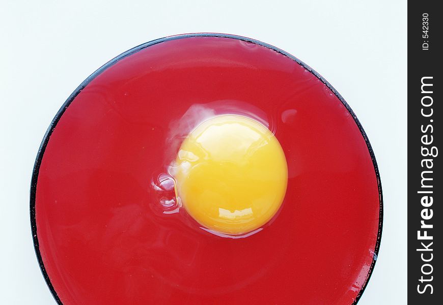 Still life with egg on red and white colors. Still life with egg on red and white colors