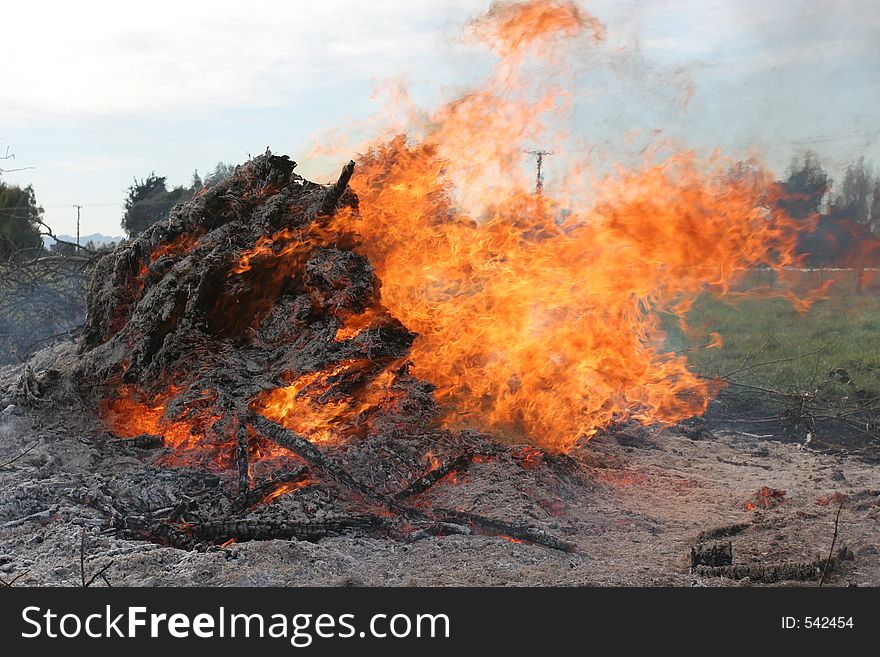 A Bonfire, on a rural property. Could be useful to make up a background for a layout, as a component of a texture or as part of an illustration for fire safety/equipment.  Taken in full sunligh, whereas most fire pics on here seem to be in the dark..  A point of difference?  Who knows. :-).