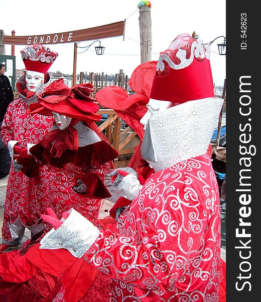 A group of masks representing a garden of roses. An image taken in venice during the 2006 carnival. A group of masks representing a garden of roses. An image taken in venice during the 2006 carnival.