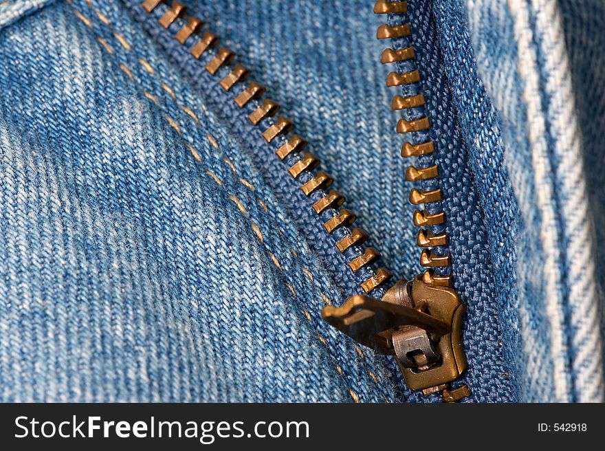 Macro of zipper on denim jeans. Macro of zipper on denim jeans