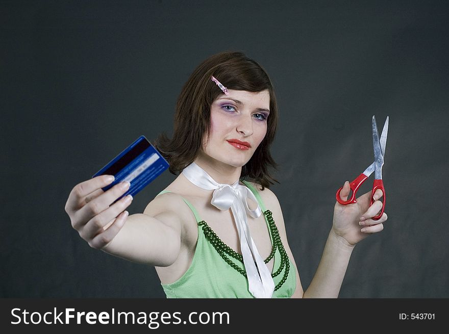Young woman with credit card and scissors. Young woman with credit card and scissors