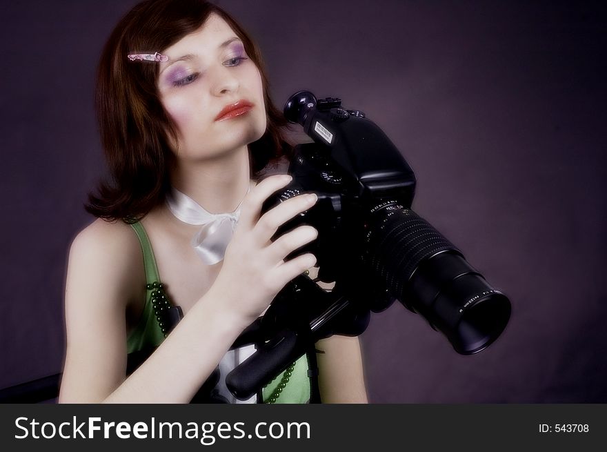 Woman with a studio camera. Woman with a studio camera