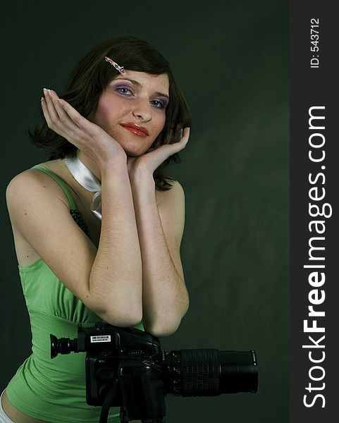 Young woman and studio camera. Young woman and studio camera