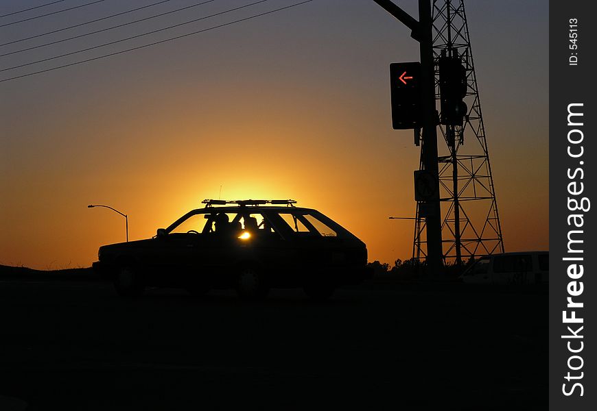 San Diego frewway overpass with automobile at sunset. San Diego frewway overpass with automobile at sunset