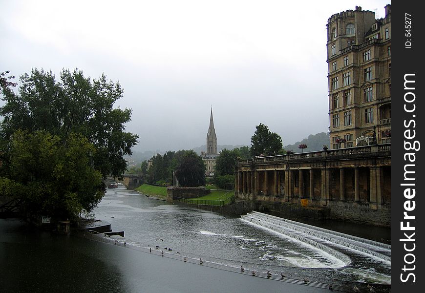River and waterfall, bath, england on cloudy day