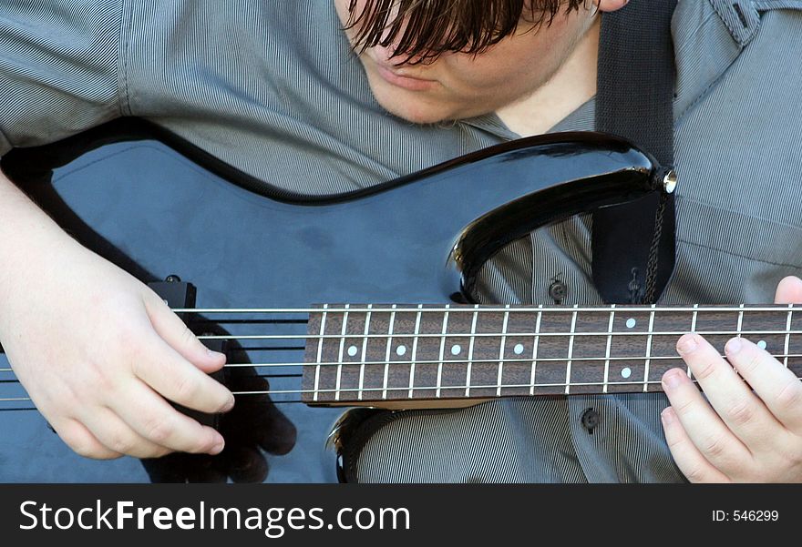 Teenage Boy Playing Bass. Teenage Boy Playing Bass