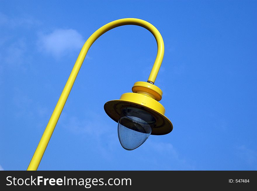 Yellow lantern on blue sky