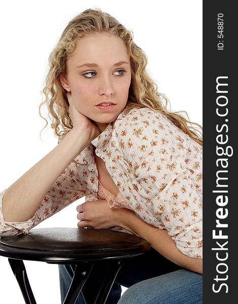Upper body shot of a beautiful blonde teen leaning on a stool. Shot with a Canon 20D. Upper body shot of a beautiful blonde teen leaning on a stool. Shot with a Canon 20D.