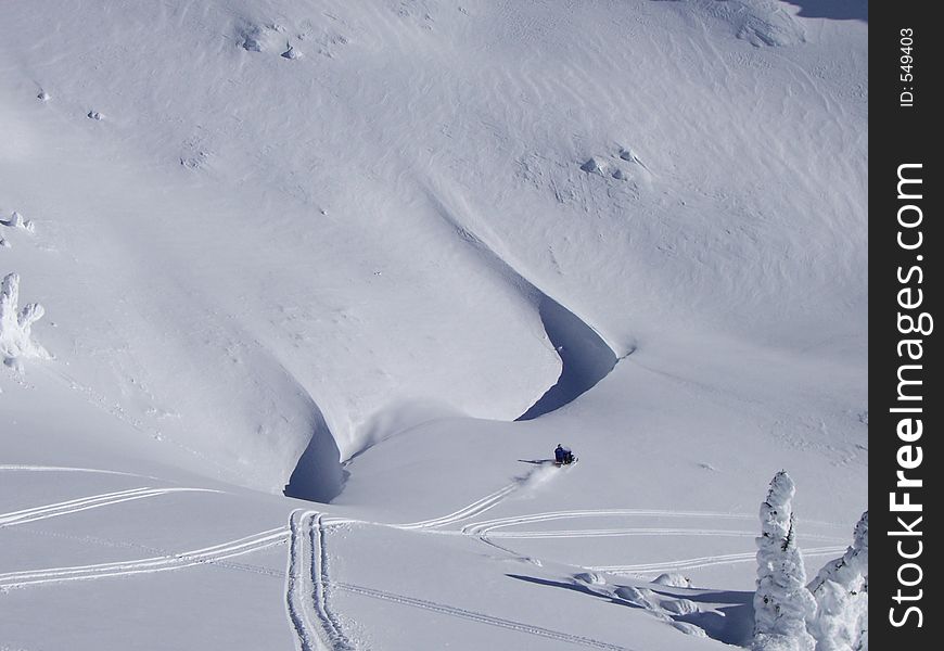 Snowmobile on untouched snow surface. Snowmobile on untouched snow surface