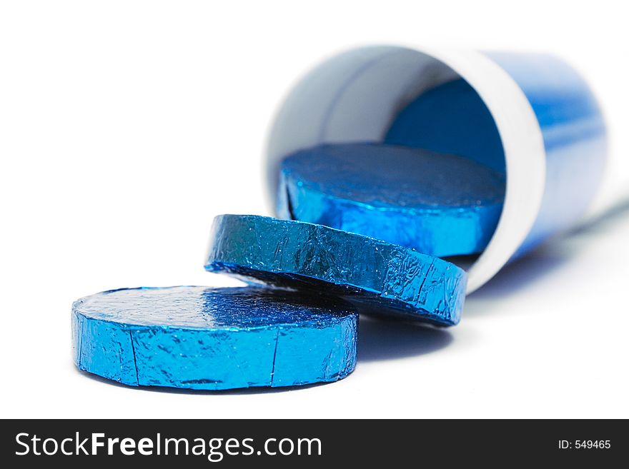 Tube of wrapped vitamin pills against a white background. Tube of wrapped vitamin pills against a white background.