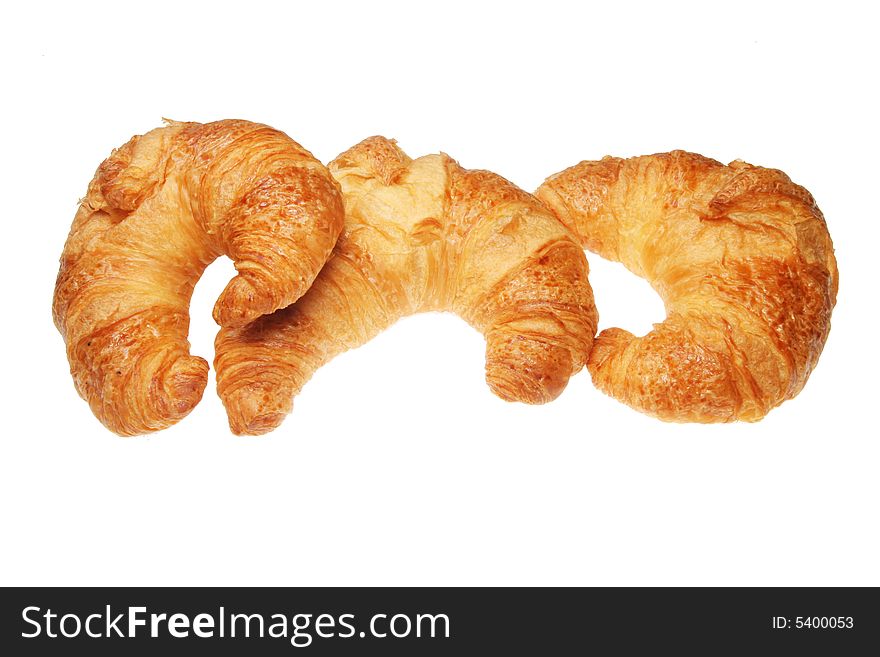 Three croissants isolated on a white background