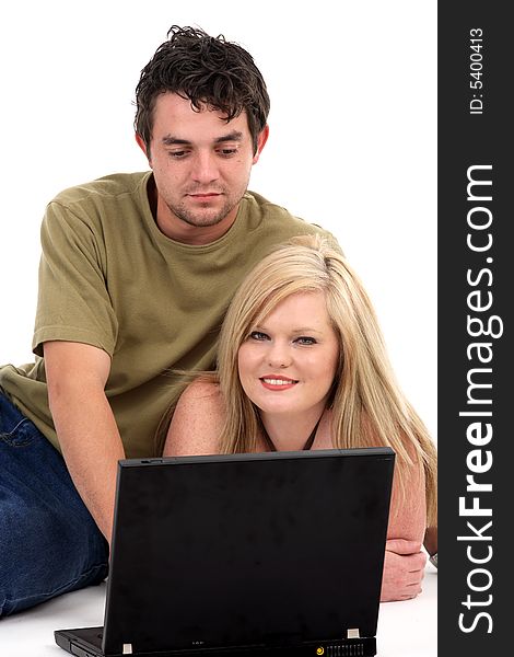 Two student working on a laptop