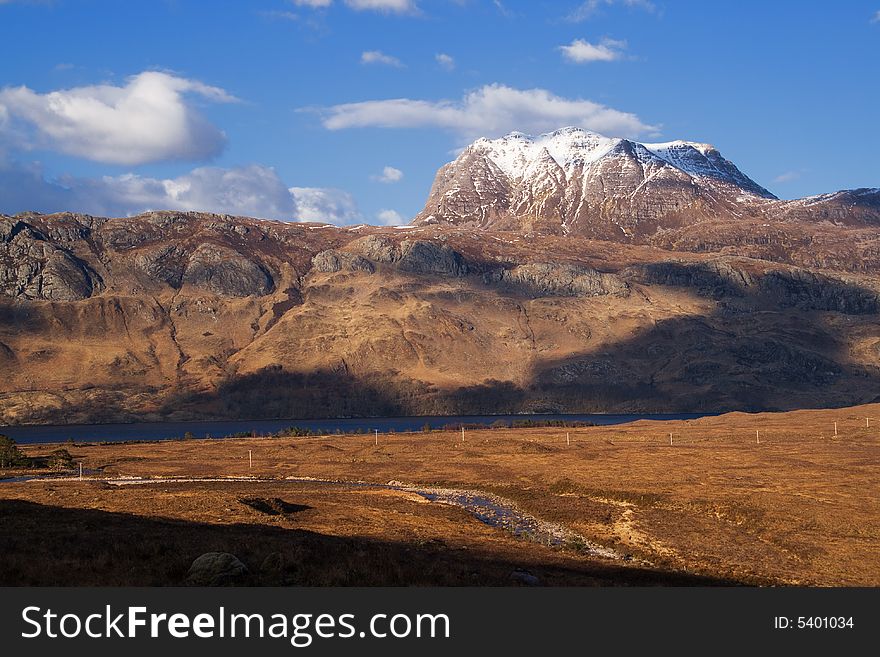 Slioch, a Scottish mountain by evening sunshine. Slioch, a Scottish mountain by evening sunshine